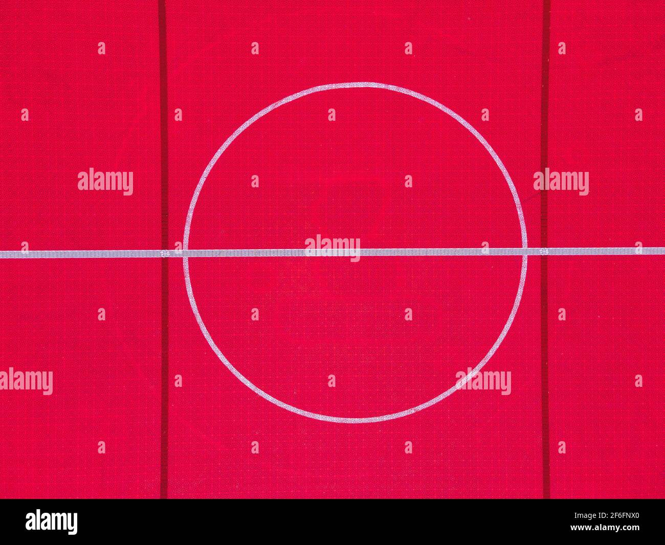 Plastic outdoor basketball court  floor, detail. Outdoor sport ground with red surface for playing basketball  in urban area, above. Stock Photo