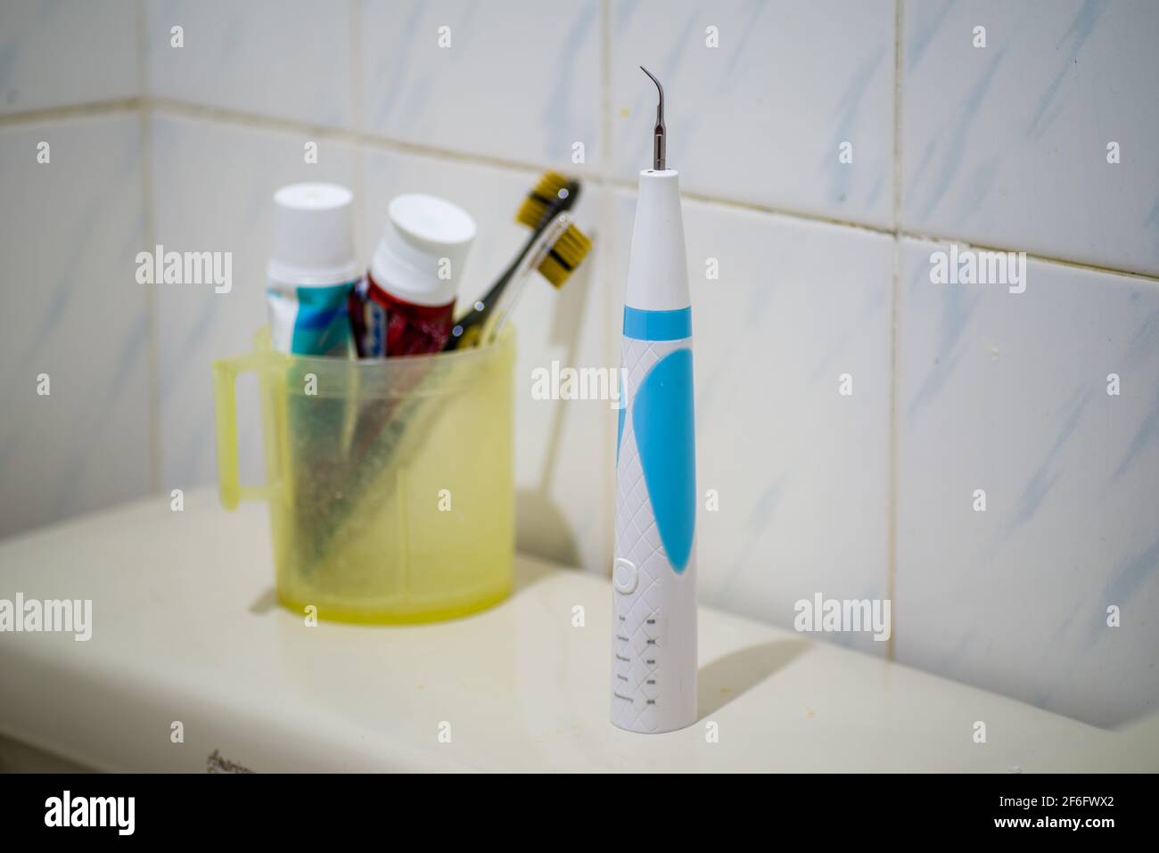Ultrasonic Teeth Cleaner use at home Stock Photo Alamy