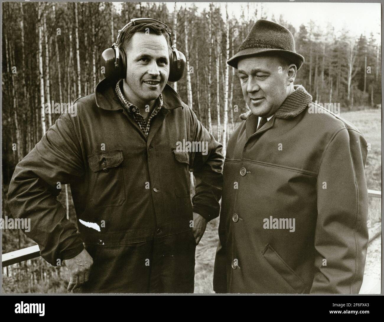 Gunnar Nordin and Overhead Master Karl-Axel Gustavsson along the railway track between Harsjön and Bälgviken in 1967. Stock Photo
