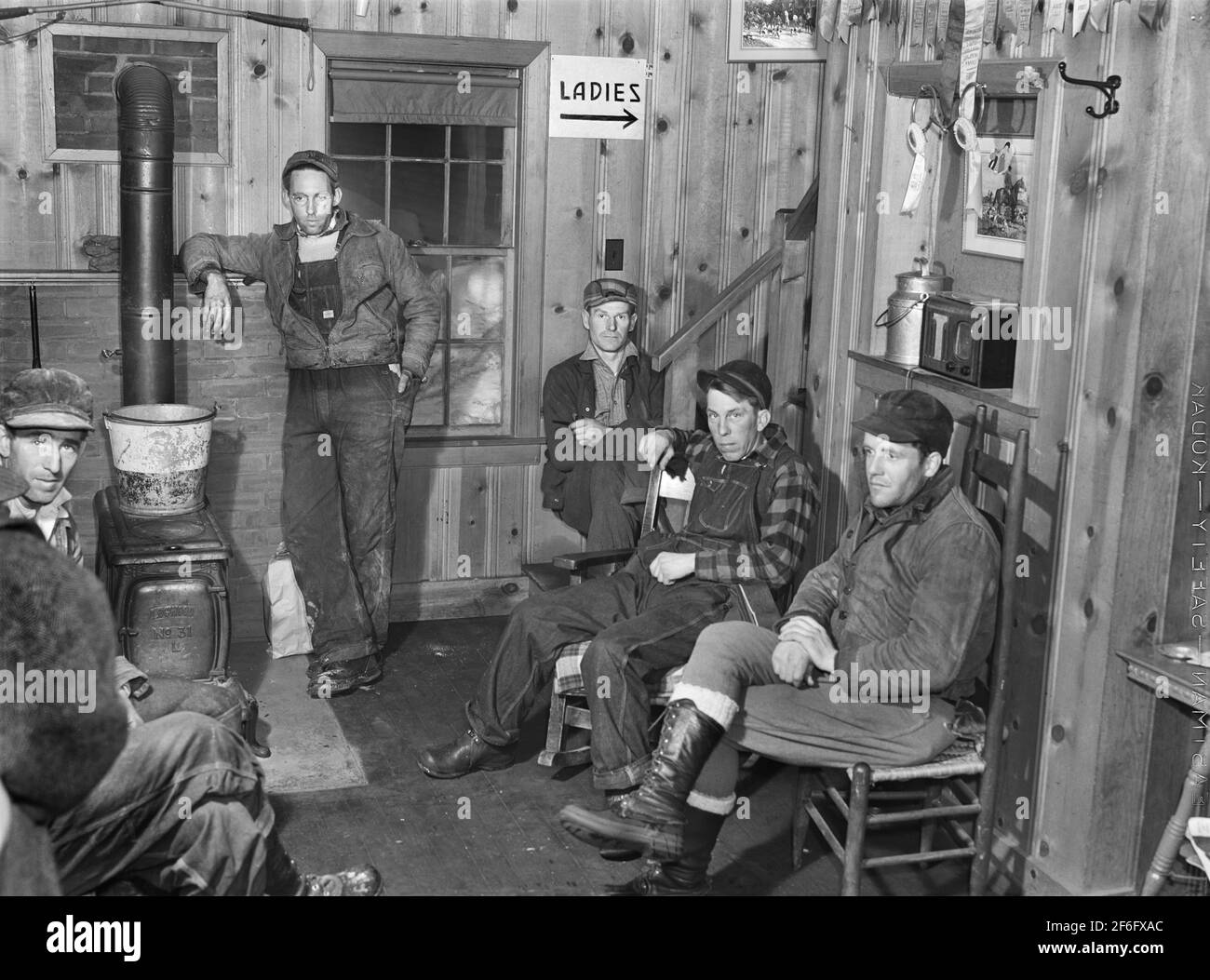 Hired help resting after day's work on Upwey horse farm, South Woodstock, Vermont, USA, Marion Post Wolcott, U.S. Farm Security Administration, March 1940 Stock Photo