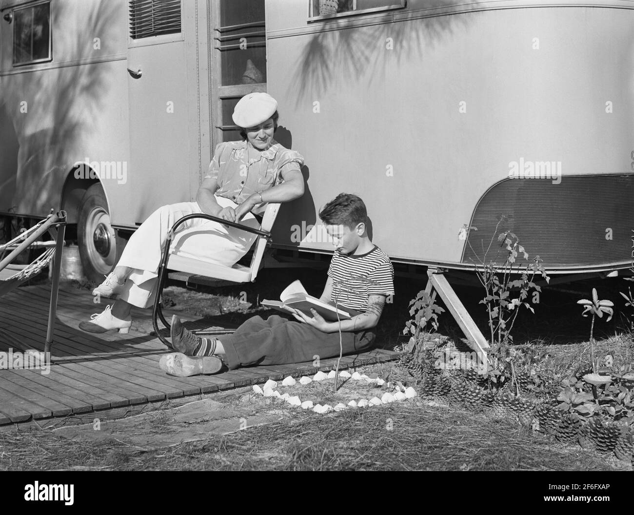 Mother listening to son read. Sarasota trailer park, Sarasota, Florida, USA, Marion Post Wolcott, U.S. Farm Security Administration, January, 1941 Stock Photo
