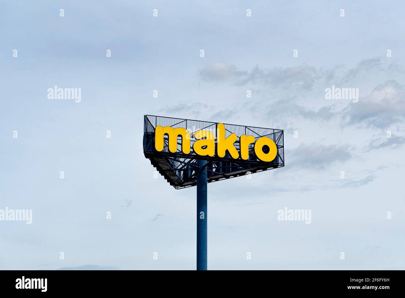 Warsaw, Poland, Sept 2020: Logo of Makro Cash & Carry wholesale supermarket store on blue sky background. Makro sign Stock Photo