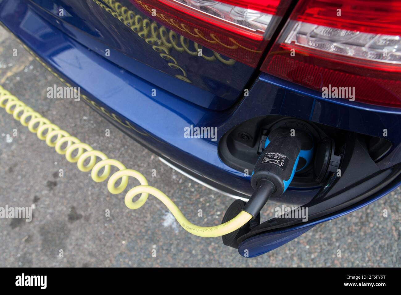 Electric car is being recharged in Brighton, East Sussex, UK Stock Photo