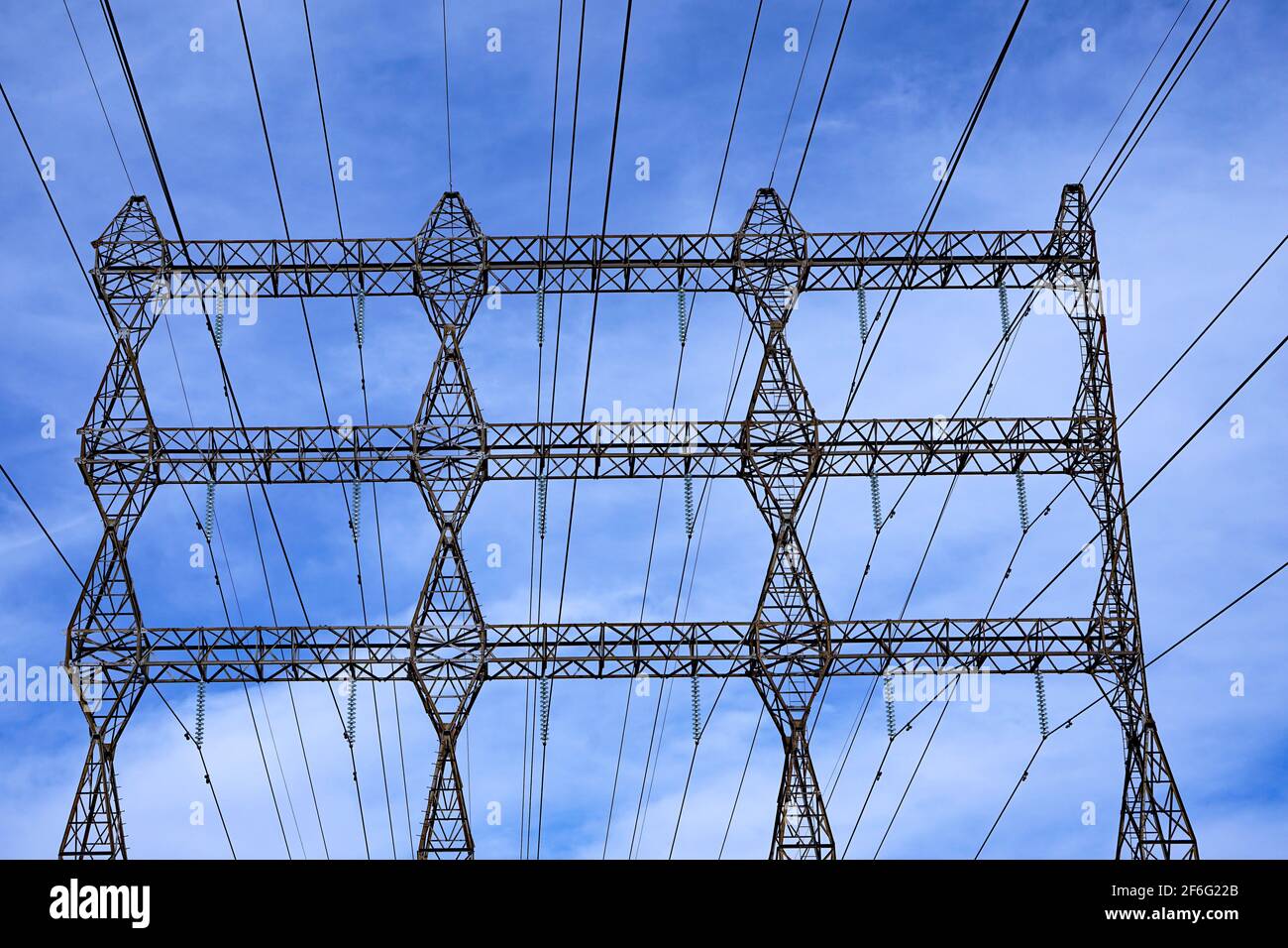 Electricity transmission lines and supporting towers Stock Photo