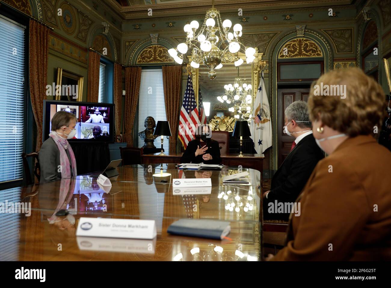 United States Vice President Kamala Harris holds a roundtable discussion with faith leaders on their efforts to encourage communities to take the COVID-19 vaccine at the White House on March 31, 2021 in Washington, DC. With the Voice President, from left to right: Bishop Marian Budde, Episcopal Church, Reverend Walter Kim, National Association of Evangelicals, and Sister Donna Markham, Catholic Charities USA.Credit: Yuri Gripas/Pool via CNP | usage worldwide Stock Photo