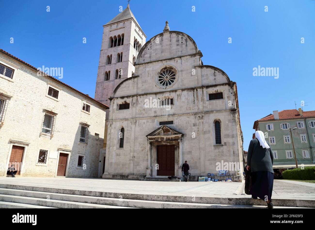 Nun walking towards St. Mary's Church, a Benedictine monastery in Zadar, Croatia, founded in 1066 Stock Photo