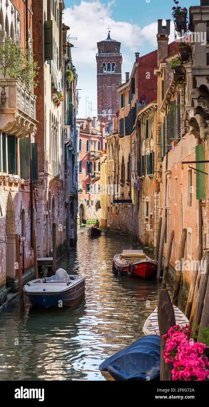 Italy. The cityscape and architecture of Venice. Urban canal and boats on it Stock Photo