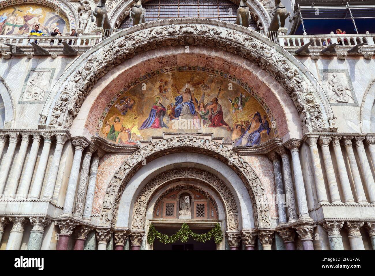 Mosaic of Jesus Christ bearing the cross, enthroned in heaven, above the west main entrance to Saint Mark's Basilica, Basilica San Marco,Venice, Italy Stock Photo