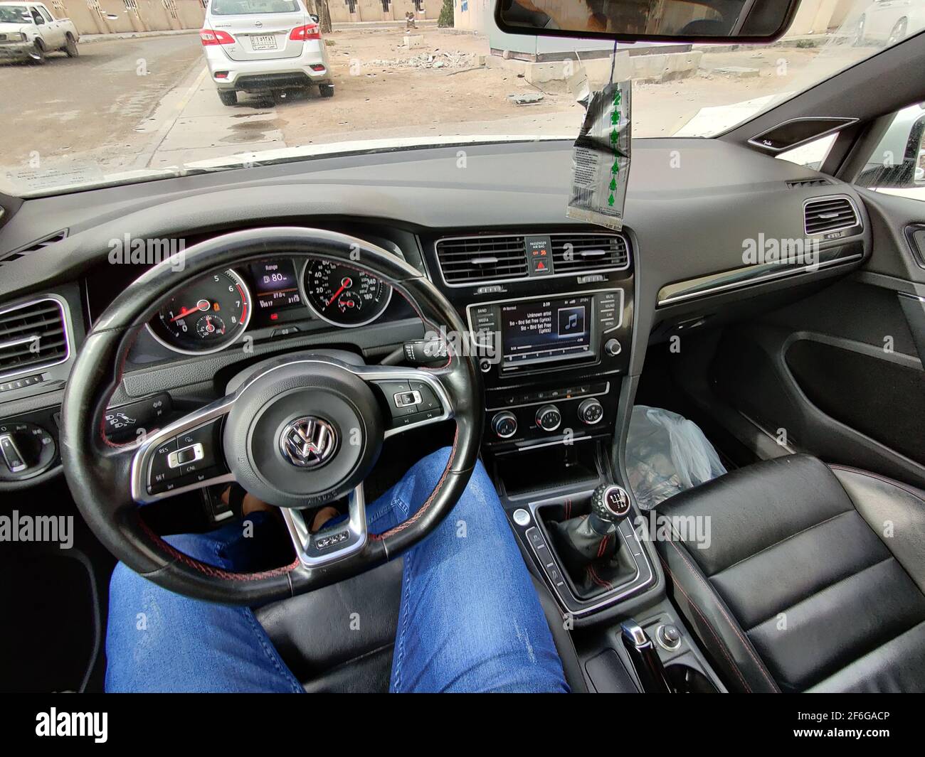 basra, Iraq - january 27, 2019:  photos behaind the car steering wheel Stock Photo