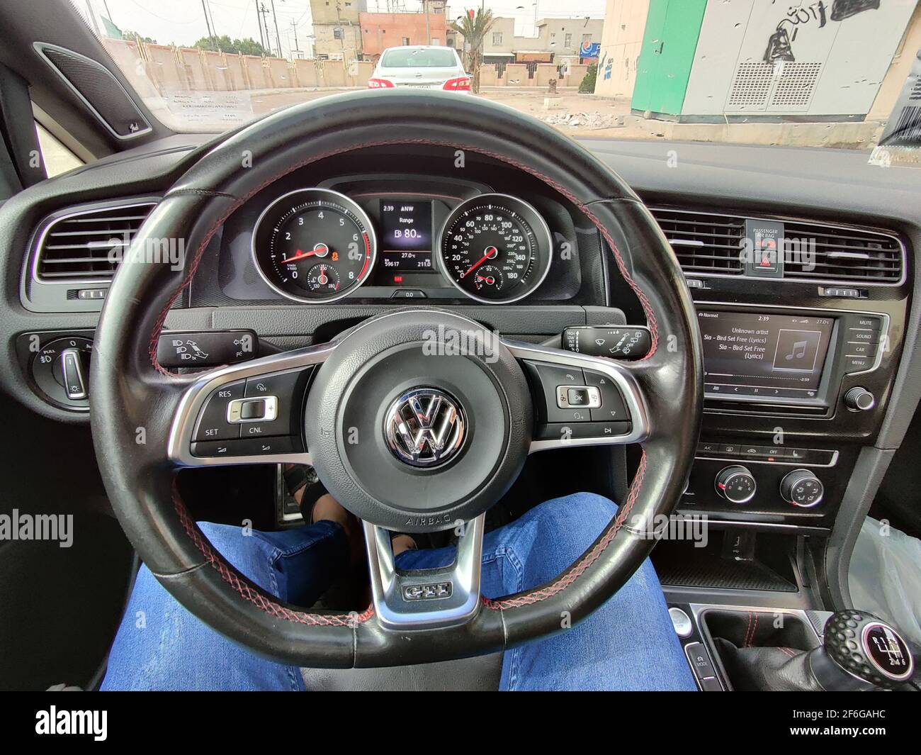 basra, Iraq - january 27, 2019:  photos behaind the car steering wheel Stock Photo