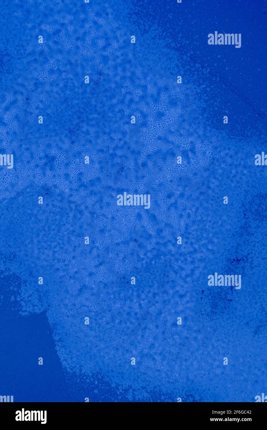 deep rich blue background with weathering texture and discoloration Stock Photo