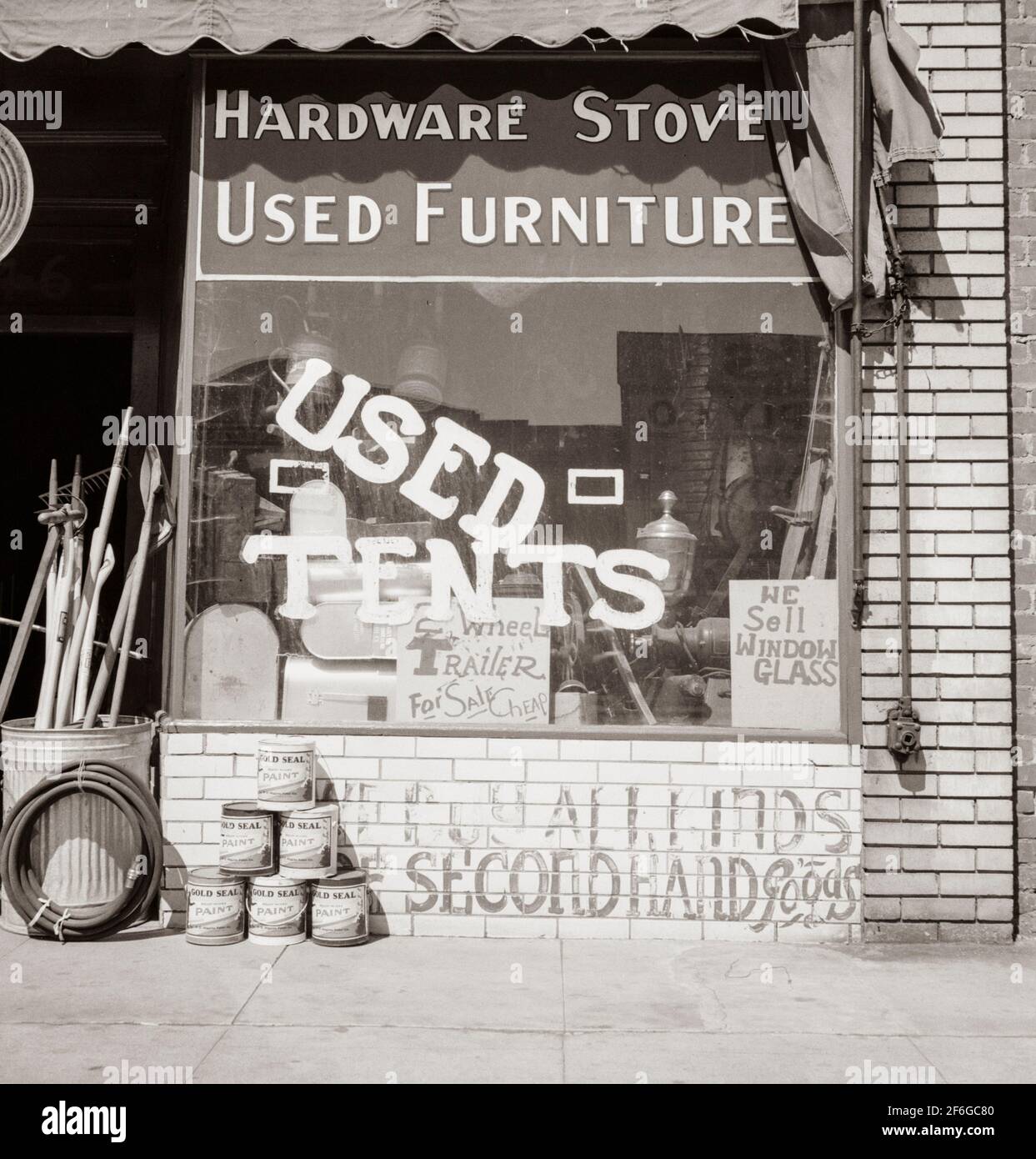Hardware store. Used tents. Fresno. On U.S. 99. Storefront of San