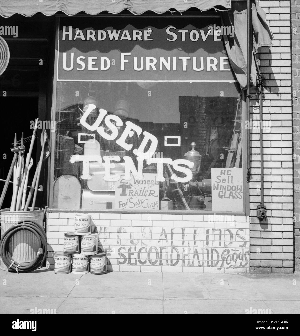 Hardware store. Used tents. Fresno. On U.S. 99. Storefront of San Joaquin Valley town