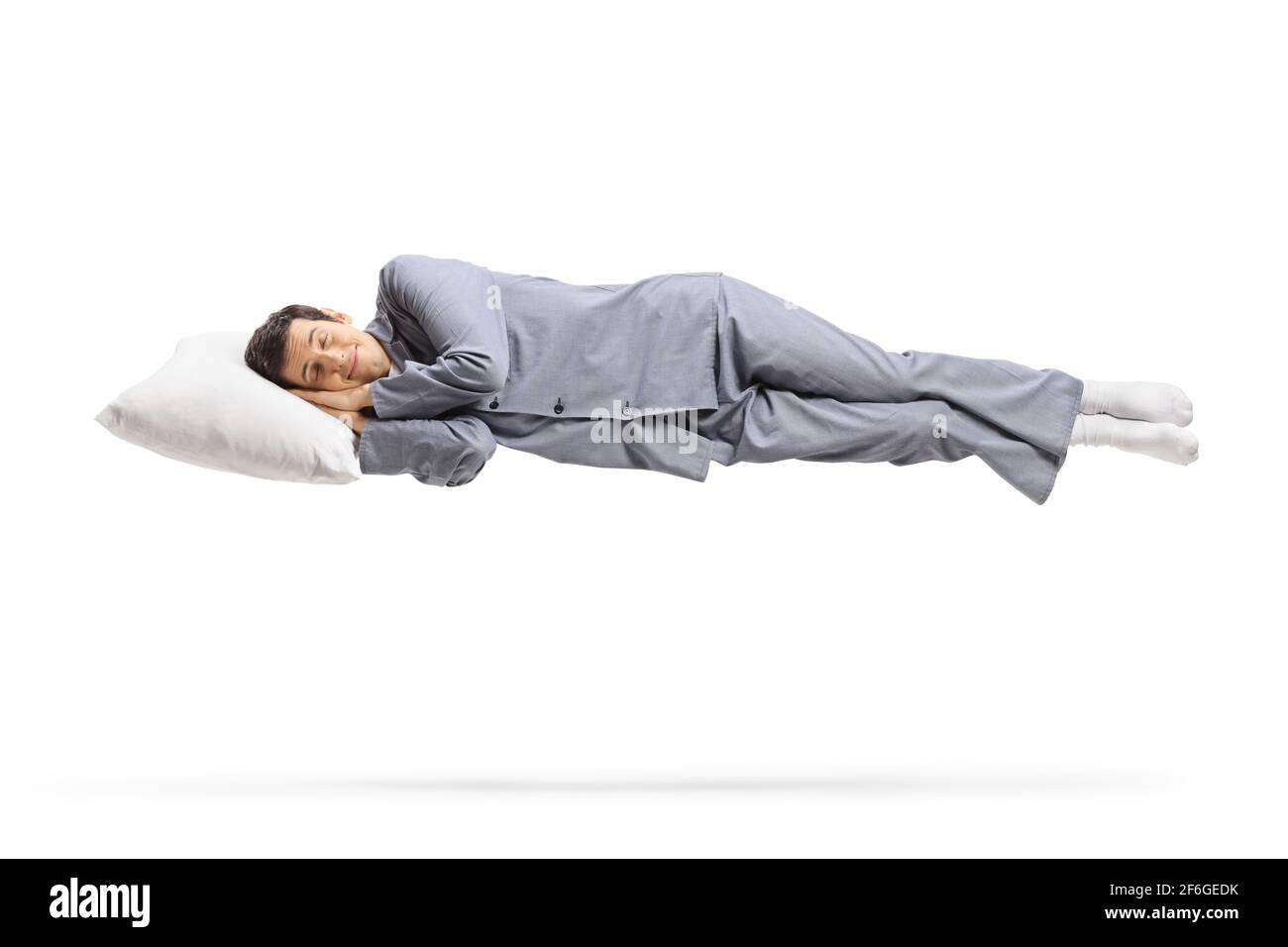 Man in pajamas sleeping on cloud and floating isolated on white background Stock Photo Alamy