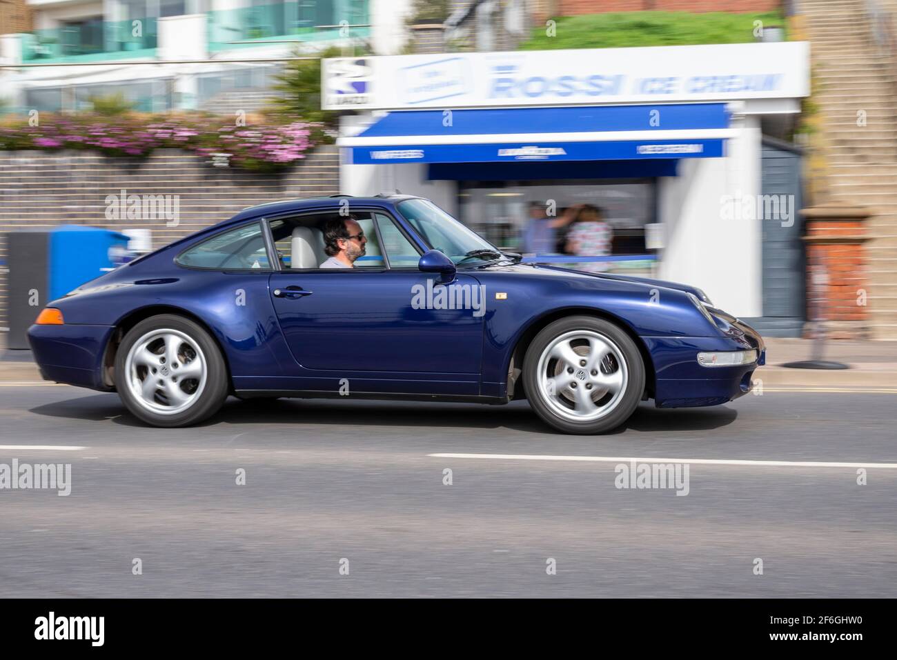 Classic shape Porsche 911 driving in Southend on Sea, Essex, UK. Iconic side profile Stock Photo