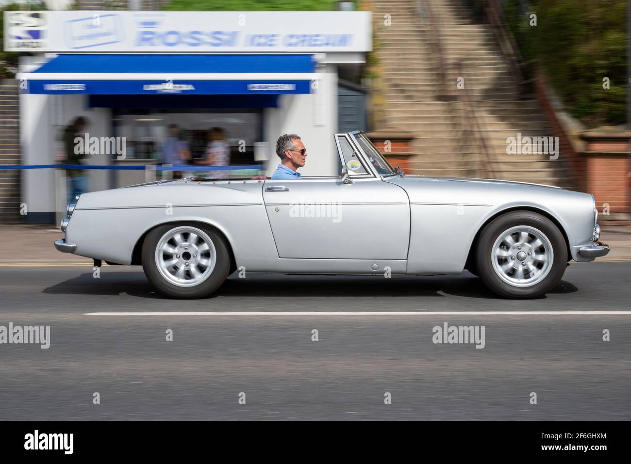 1966 Datsun Fairlady sports car driving in Southend on Sea, Essex, UK. Roadster convertible with the top down. Japanese Nissan classic car Stock Photo