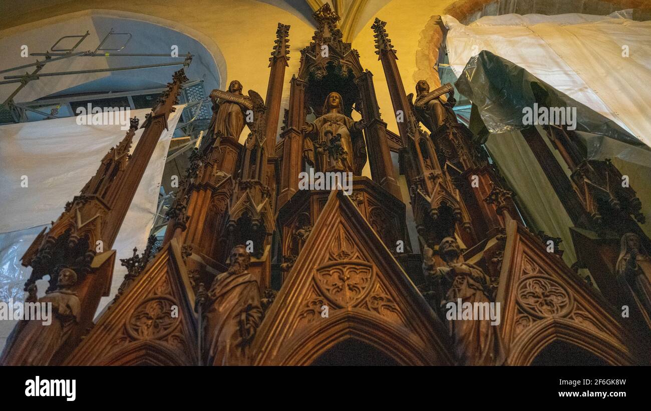 The oak Gothic antique cabinet in the Catholic cathedral Stock Photo