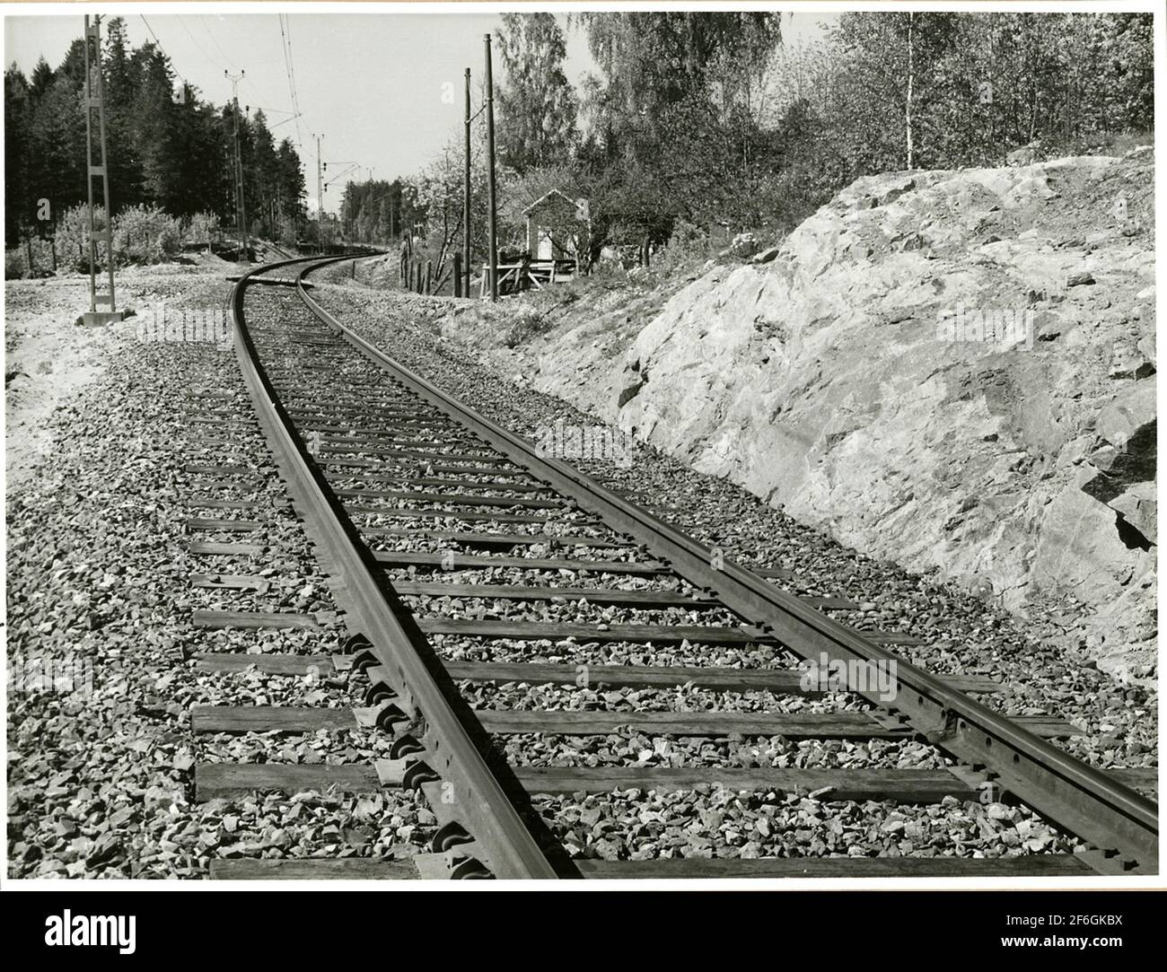 Railway distance at Skutskär, track with Fair T railing barrier. Stock Photo