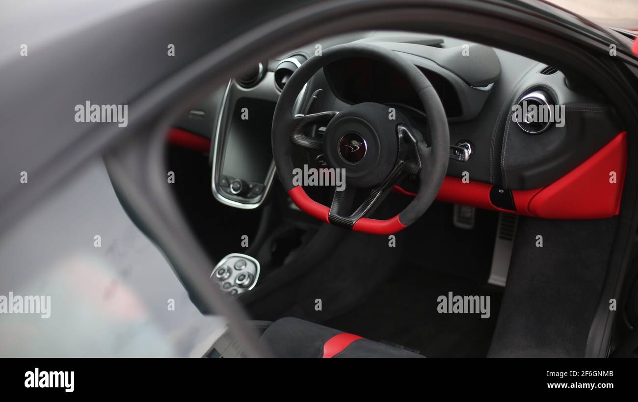The Interior Of A 2017 McLaren 570S With Two Tone Black And Red Interior With Carbon Fibre Trim Stock Photo