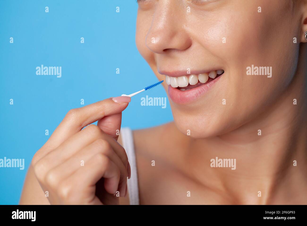 Woman uses brushes to clean the interdental spaces Stock Photo Alamy