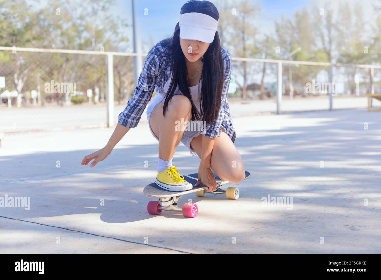 Young asian women play surf skate board at park skate ramp outdoors on  morning. Happy women play surfskate board at park . Sport activity  lifestyle co Stock Photo - Alamy