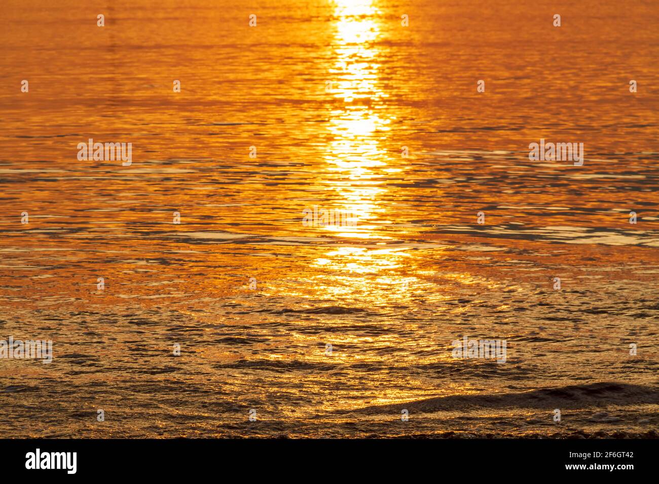 Golden sunset light reflection in sea water, Abstract background with ...