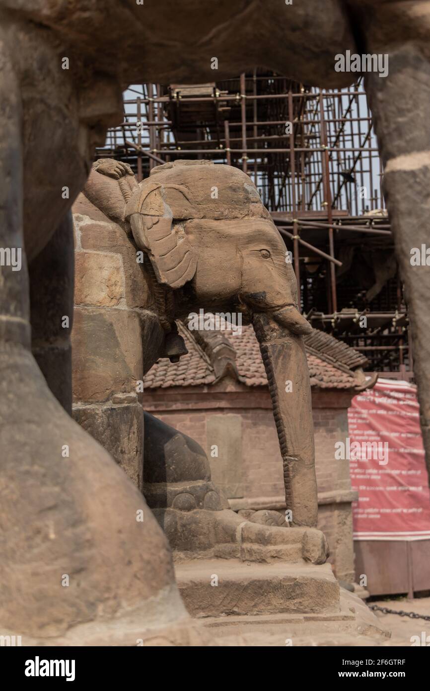 Statue of an elephant at the entrance stairs to one of the temple