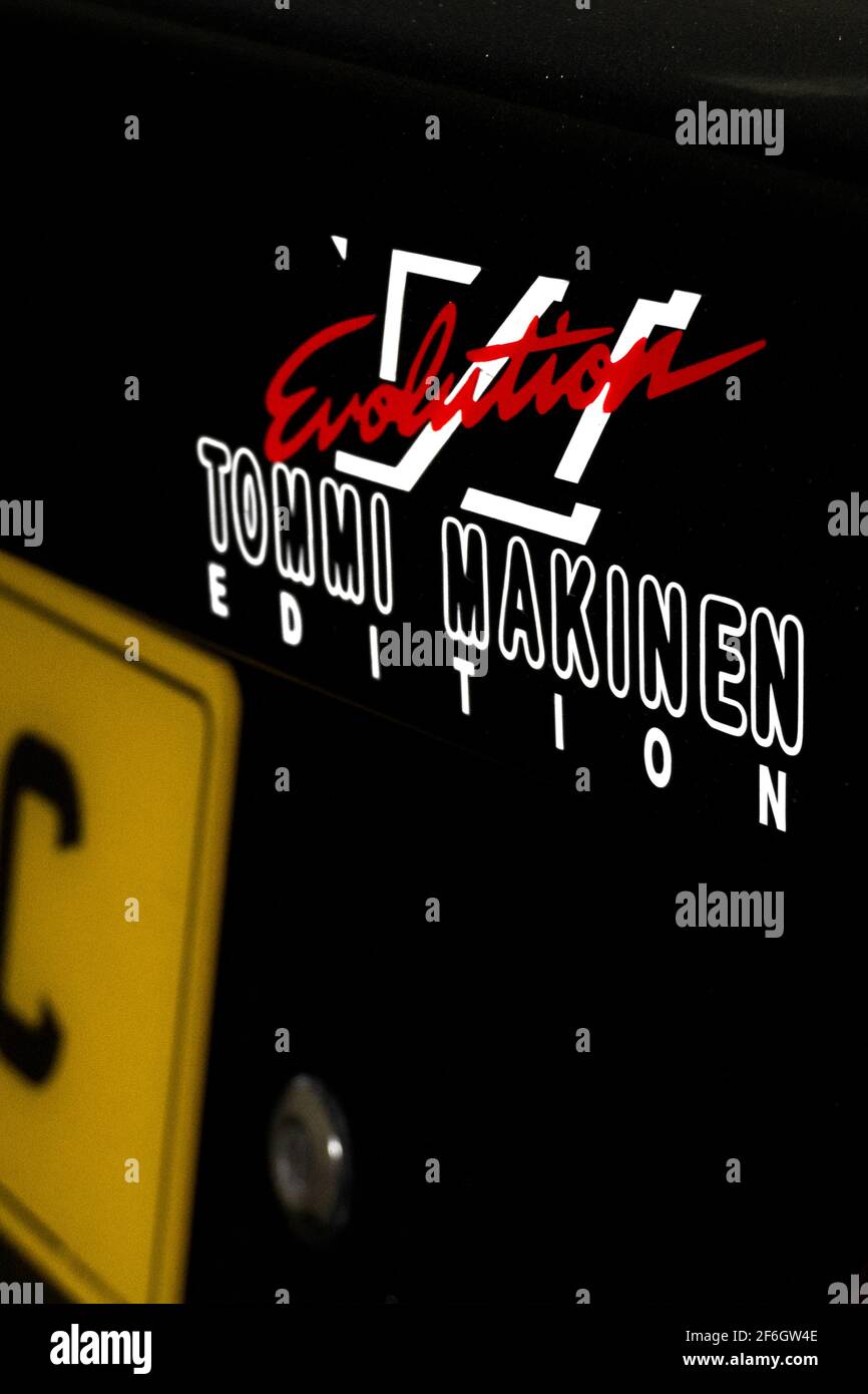 The Model Designation Badge On The Bootlid Of A 2000 Mitsubishi Lancer Evolution 6 Tommi Makinen Edition EVO 6 TME Stock Photo