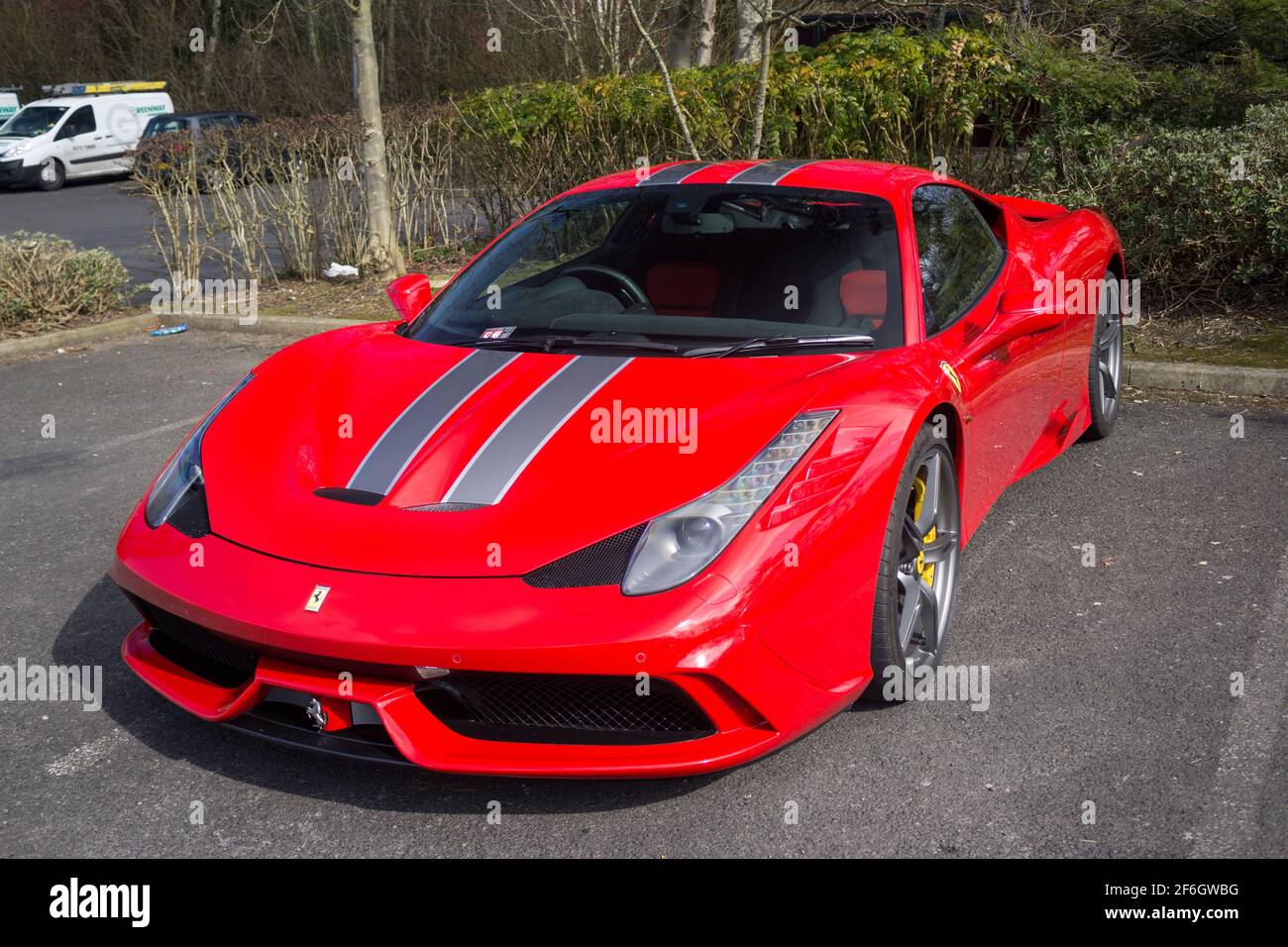 The 2015 Ferrari 458 Speciale In Metallic Red With Dual Grey Stripes From Front To Back Stock Photo