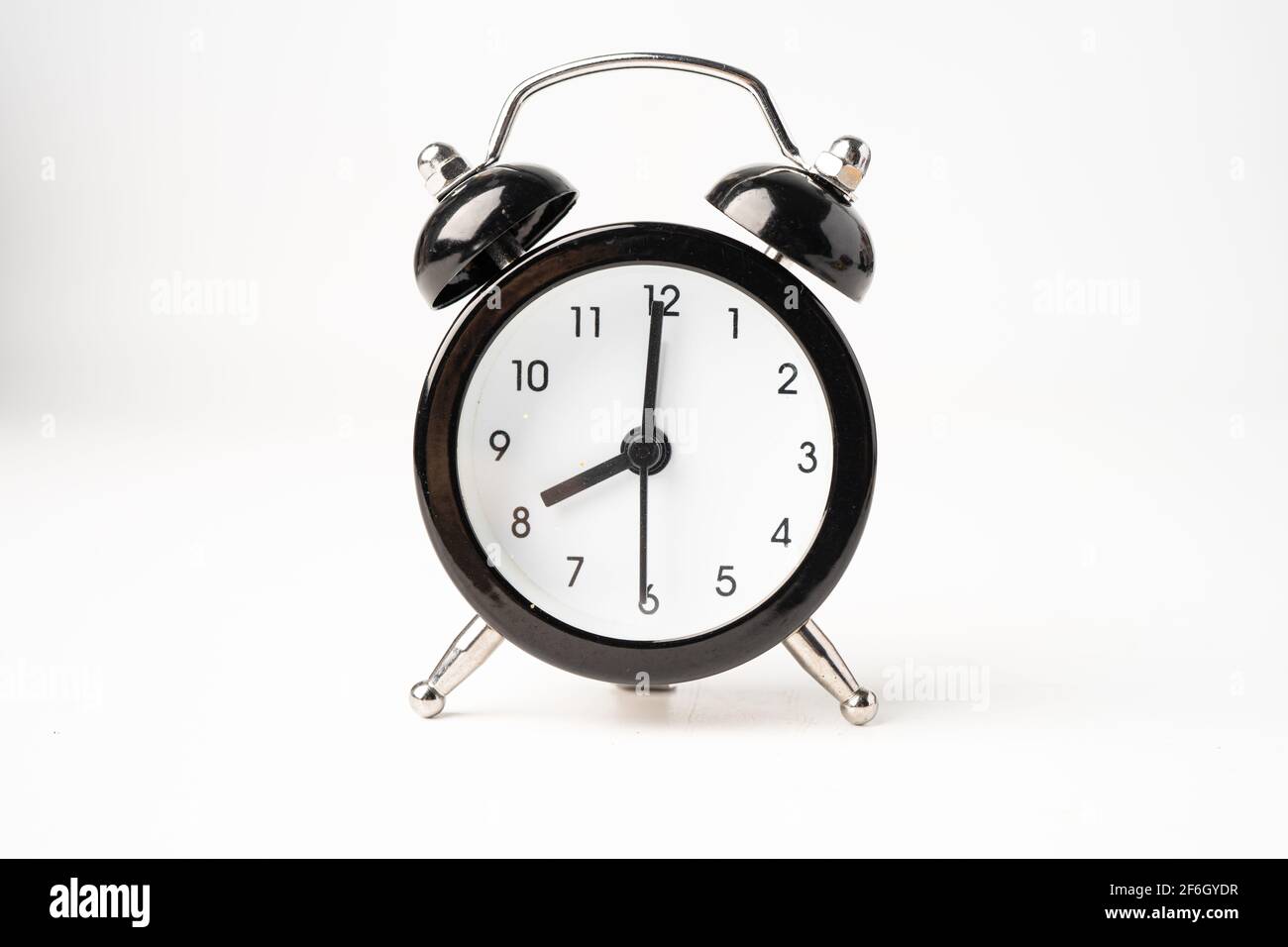 Black alarm clock isolated on white background Stock Photo - Alamy