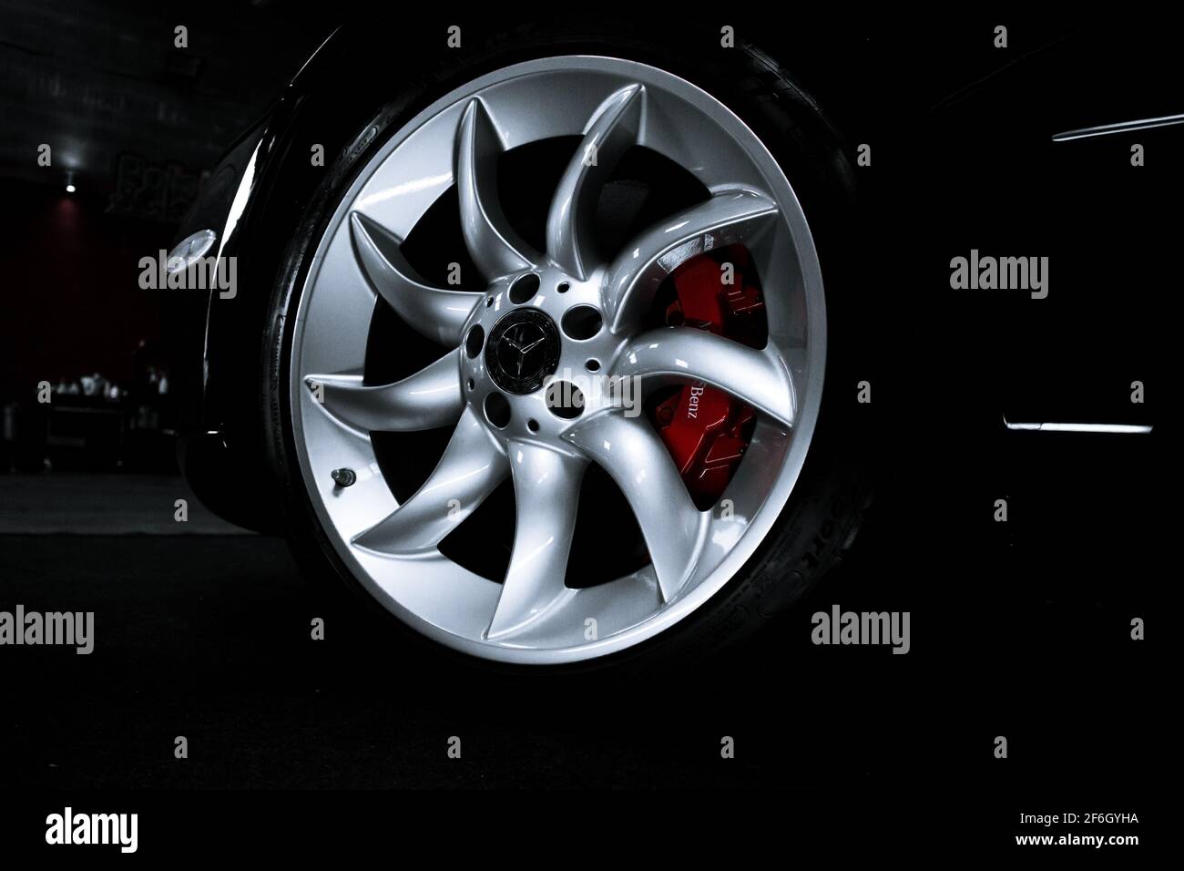 The Front Silver Alloy Wheel On A 2004 McLaren Mercedes SLR With Red Brake Callipers Stock Photo
