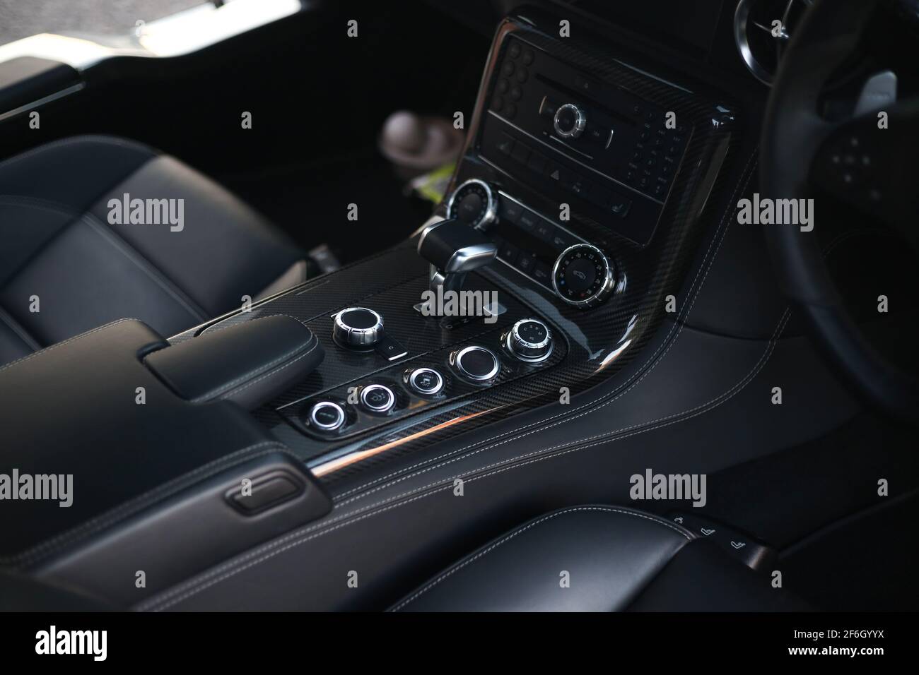 The Carbon Fibre Centre Console On The Interior Of A 2009 Mercedes Benz SLS AMG Stock Photo