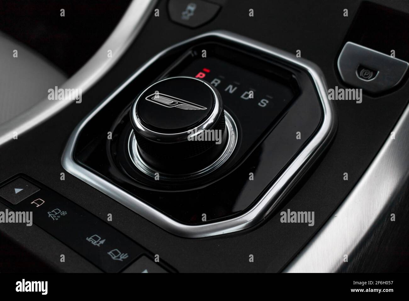 https://c8.alamy.com/comp/2F6H057/an-automatic-gear-stick-inside-the-2017-land-rover-range-rover-evoque-with-gloss-black-overfinch-gear-selector-with-overfinch-logo-2F6H057.jpg