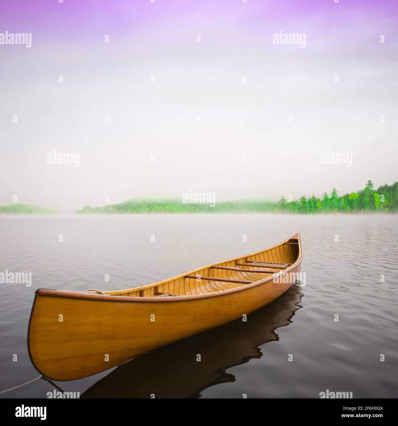 United States, New York, Saranac Lake, Wooden canoe floating on calm