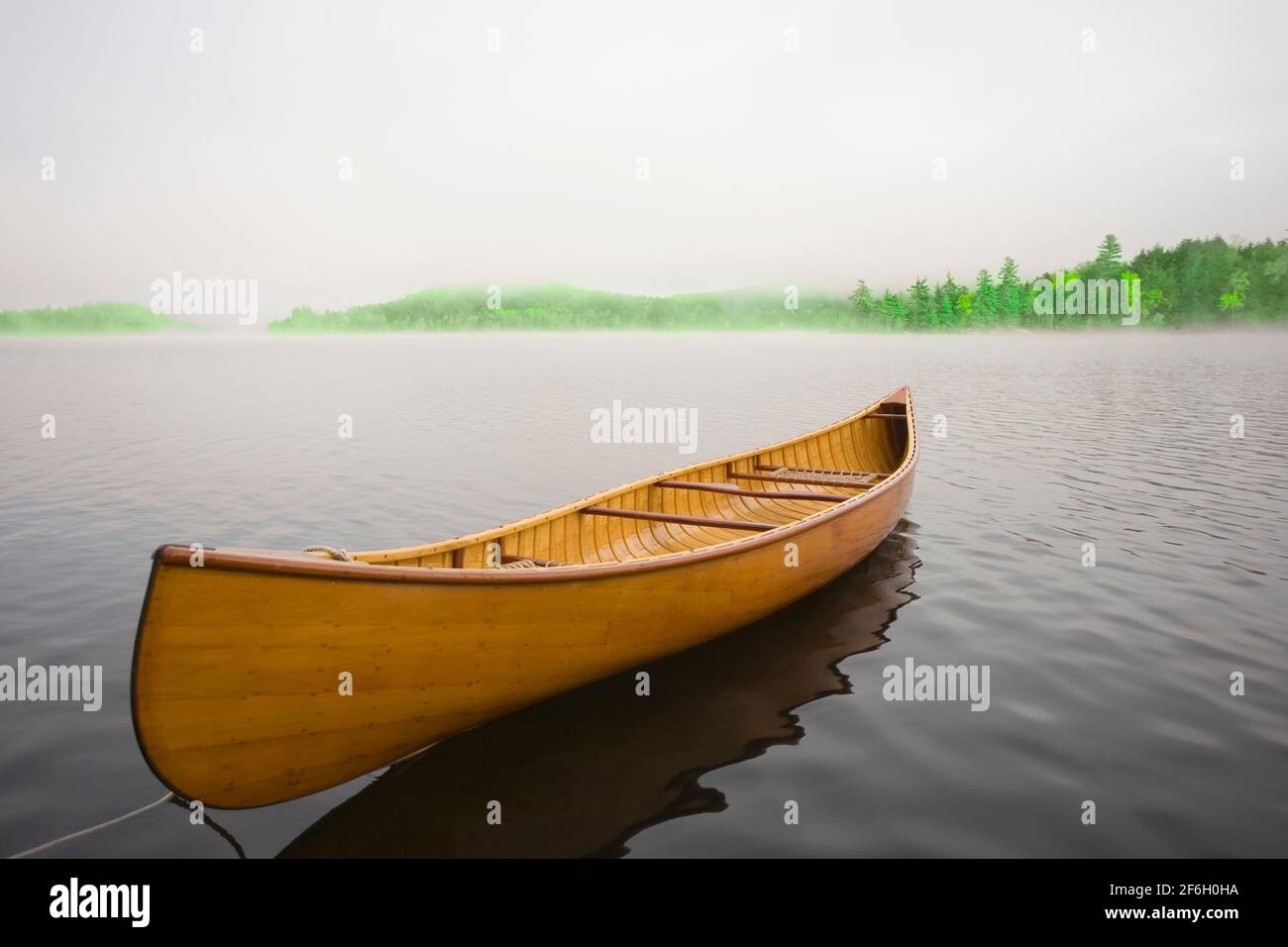 United States, New York, Saranac Lake, Wooden canoe floating on calm