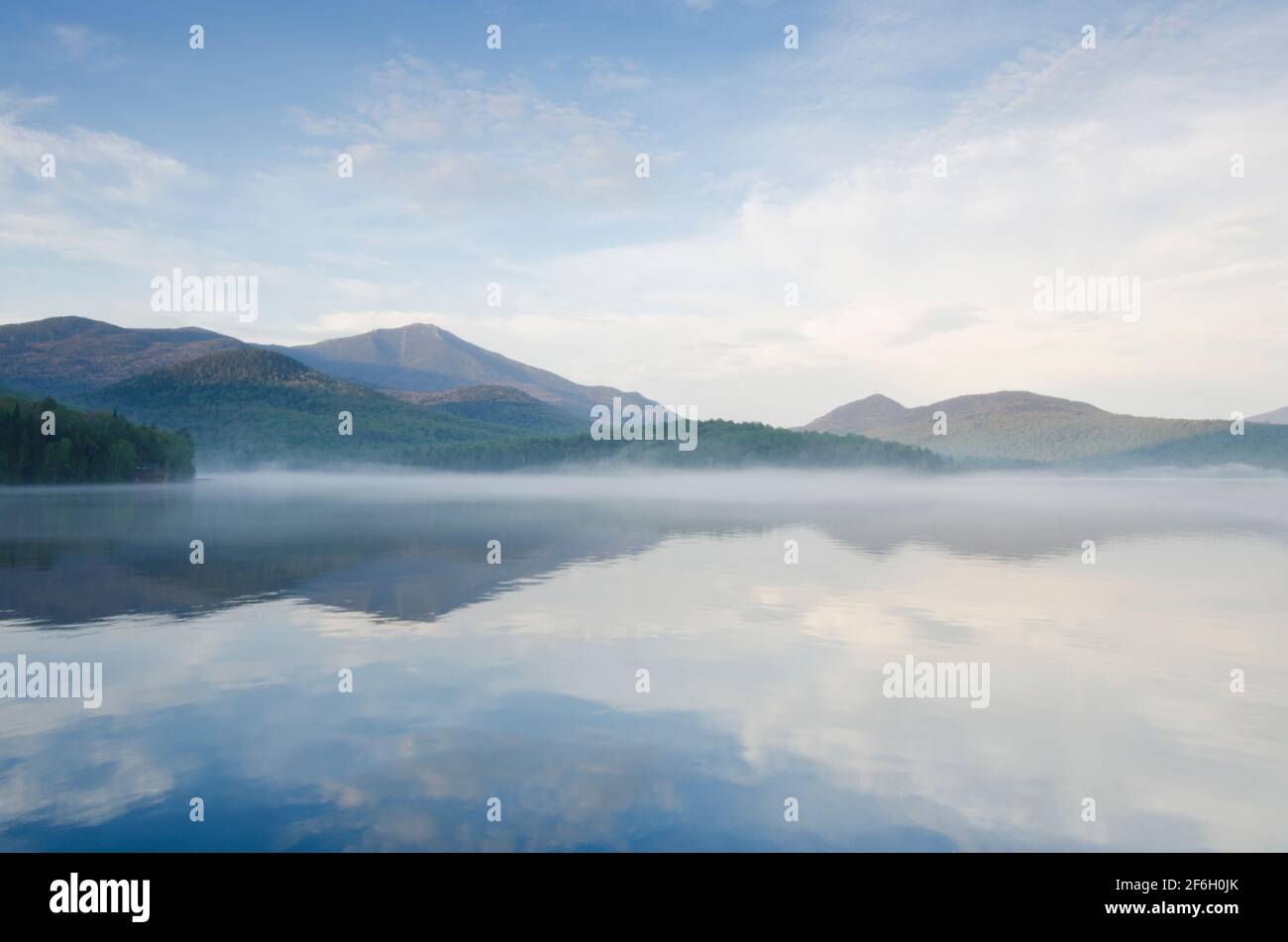 United States, New York, Lake Placid, Calm surface of Lake Placid and Whiteface Mountain Stock Photo