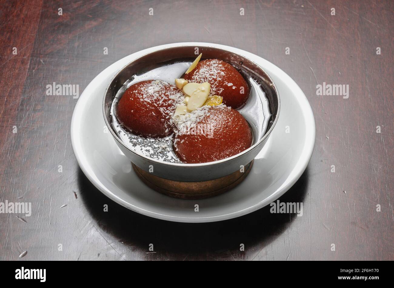 Delicious Indian dessert known as gulab jamun Stock Photo Alamy