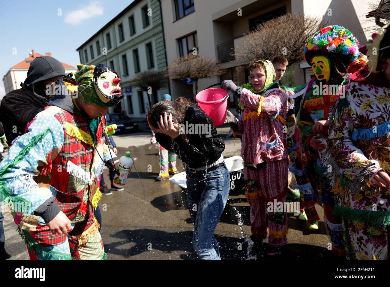 Wilamowice, Poland - April 2, 2018: Easter celebrations in Poland. Wilamowickie Smiergusty. A regional, long-standing, folk tradition focuses on pouring water on girls by boys on Easter Monday at the Market Square in Wilamowice in southern Poland. Śmiergustnicy are groups of costumers who wear colorful, traditional Smiergustnica costumes Stock Photo