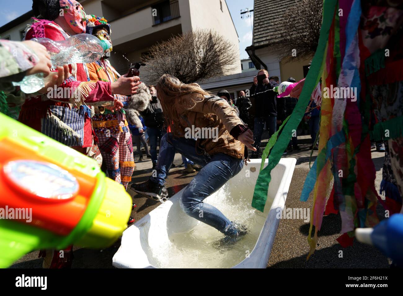 Wilamowice, Poland - April 2, 2018: Easter celebrations in Poland. Wilamowickie Smiergusty. A regional, long-standing, folk tradition focuses on pouring water on girls by boys on Easter Monday at the Market Square in Wilamowice in southern Poland. Śmiergustnicy are groups of costumers who wear colorful, traditional Smiergustnica costumes Stock Photo