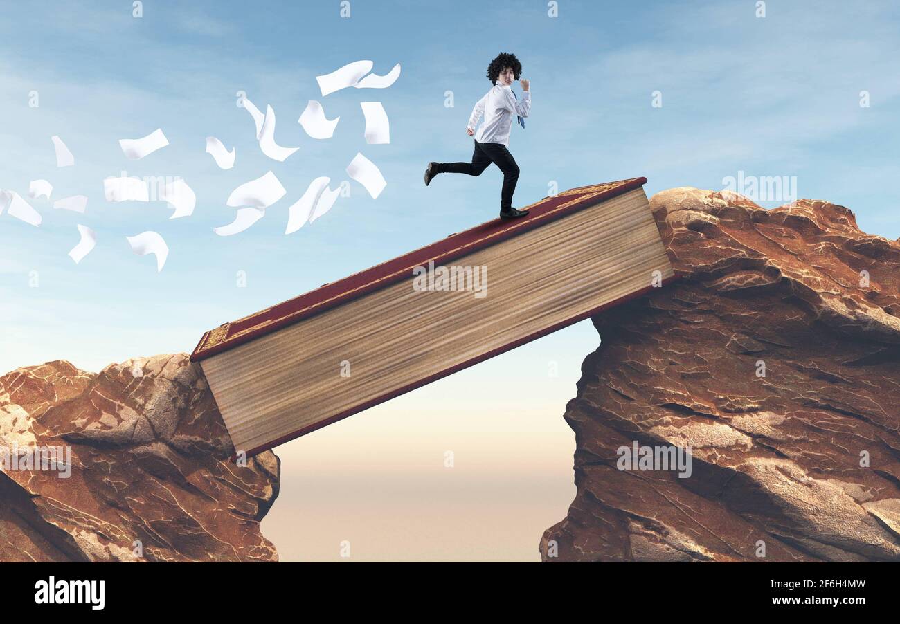 Student running over a gap between mountains on a book . Overcome any obstacle . Stock Photo