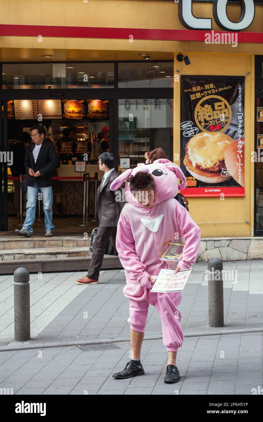 Japanese male promotional leaflet distributor dressed in pink rabbit animal onesie Ikebukuro Tokyo Japan Stock Photo Alamy
