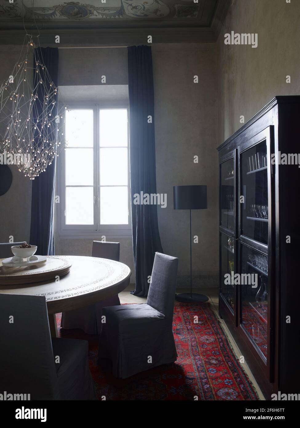 Elegant Dining room and centerpiece in a contemporary house in Italy Stock Photo