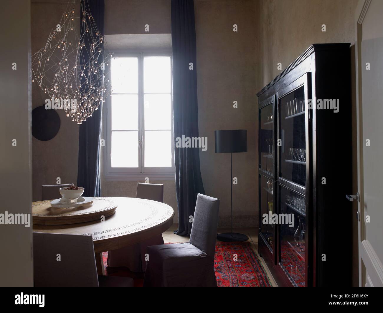 Elegant Dining room and centerpiece in a contemporary house in Italy Stock Photo