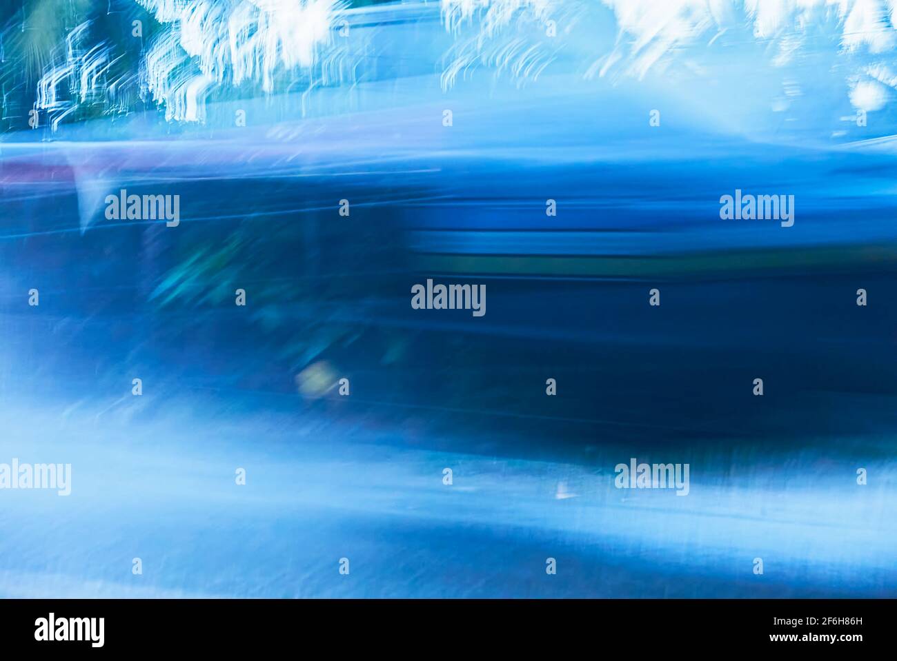 Cold blue colored blurry background with motion lines and white forms of ice crystals Stock Photo