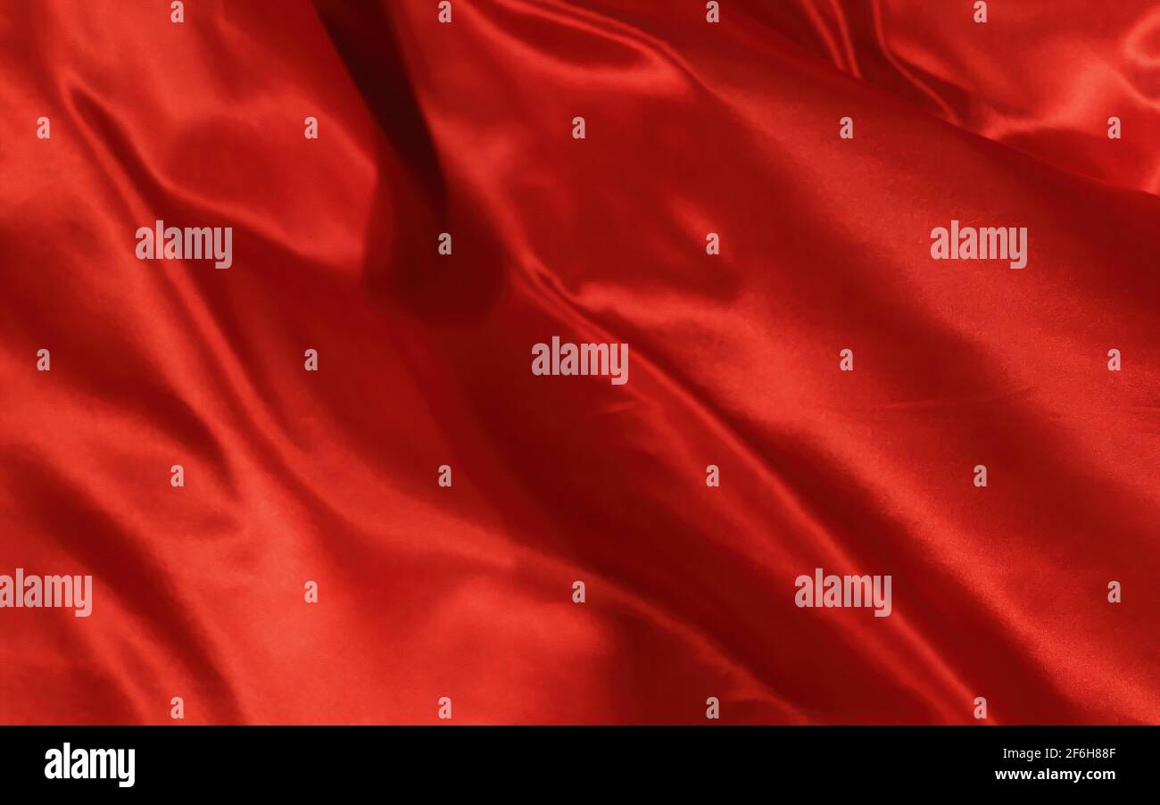 Abstract background red and orange silk or satin luxury fabric texture Stock Photo