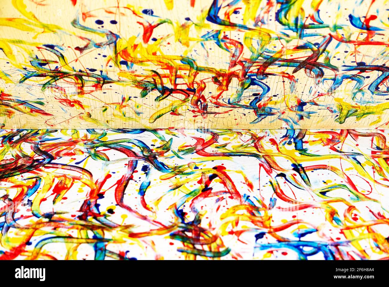 Abstract yellow creme color paint strokes like from finger painting on
