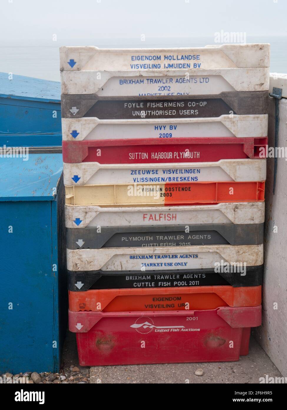 Stack of plastic crates isolated over white background Stock Photo - Alamy