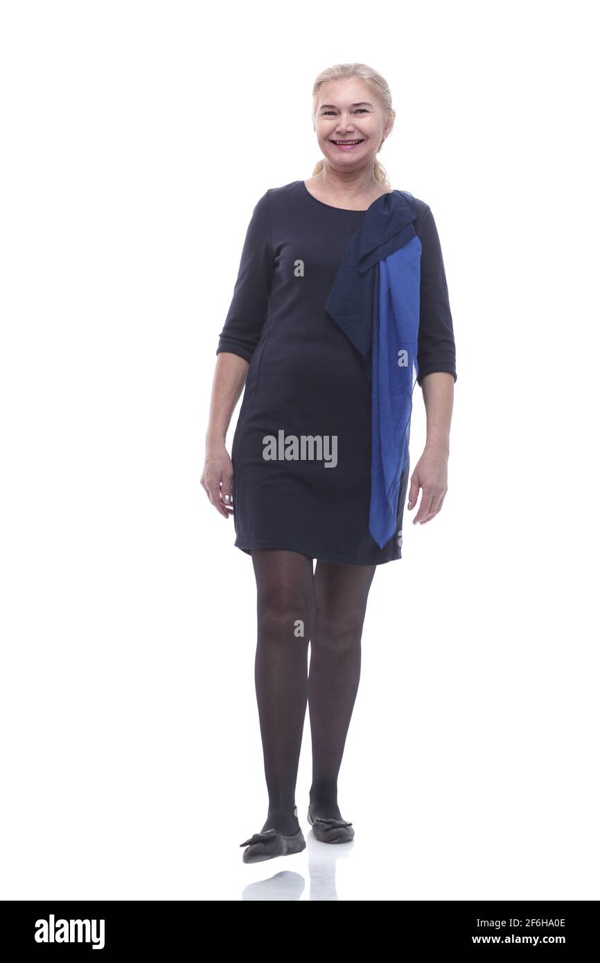 in full growth. smiling mature woman taking a step forward Stock Photo ...