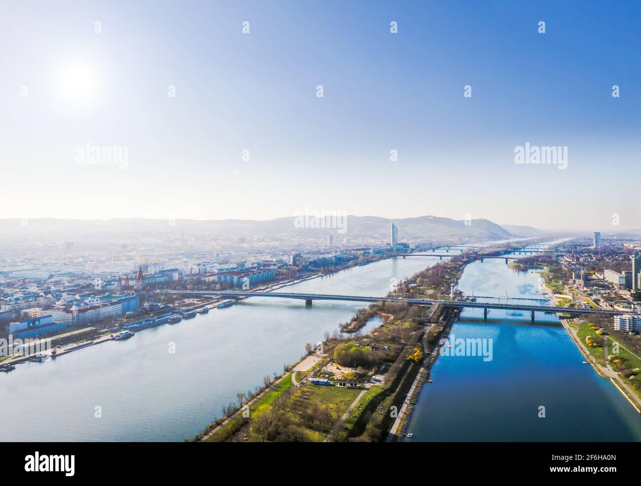 Danube and Vienna city aerial panoramic view. Donaustadt district and danube island during spring and summer. Stock Photo