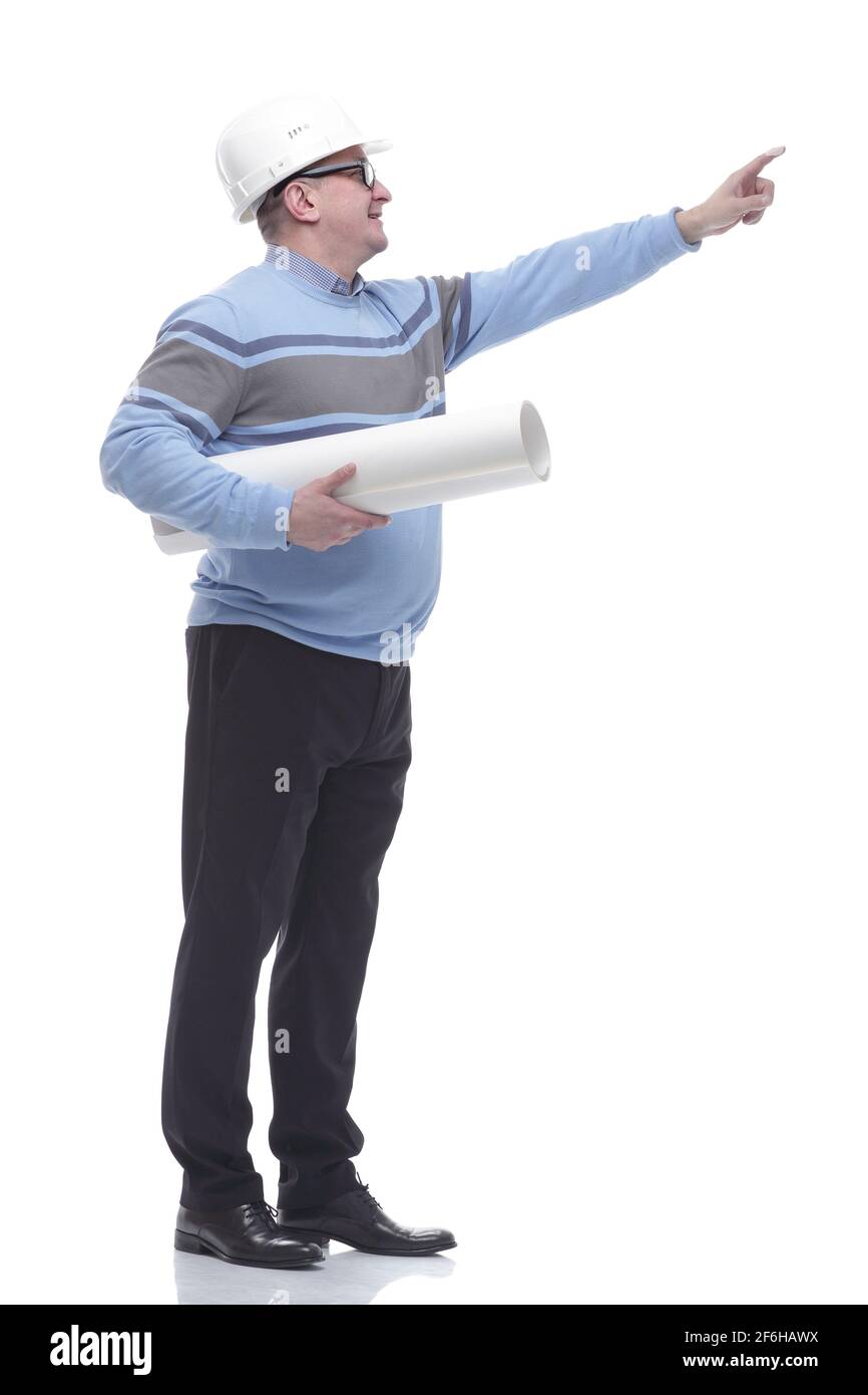 side view. a man with a roll of drawings looking somewhere ahead. Stock Photo